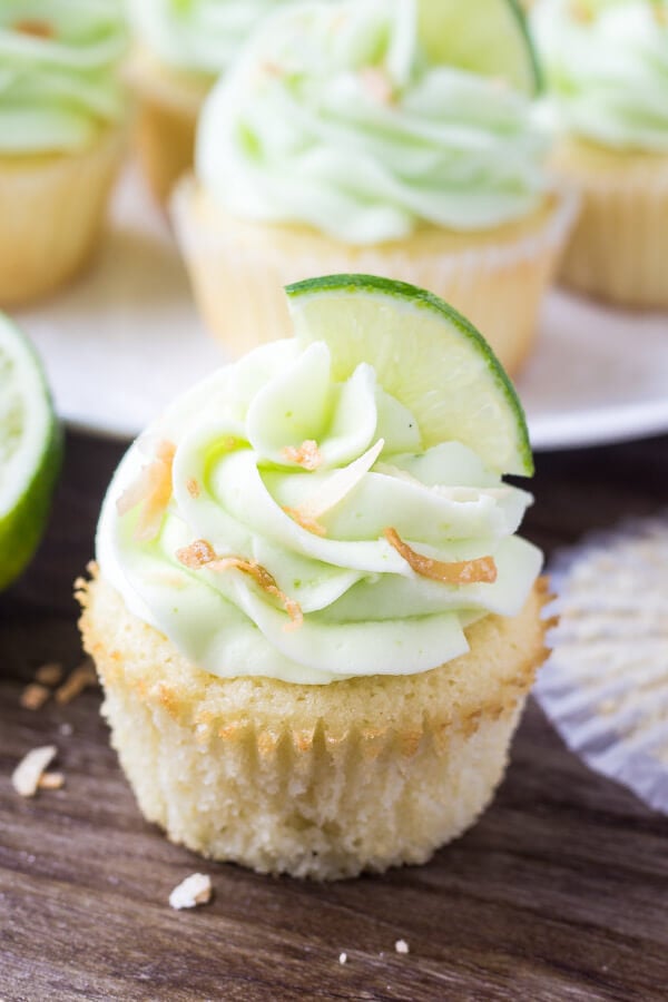 Coconut cupcake with lime frosting & toasted coconut - Muffin paper removed. 