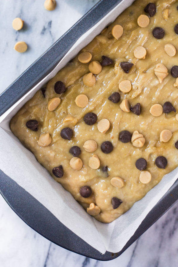 Unbaked peanut butter banana bread batter in a loaf pan, ready to bake. 