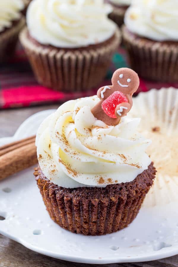 Spiced gingerbread cupcakes that are moist, fluffy & filled with holiday cheer. Then they're frosted with tangy, sweet cream cheese frosting and a sprinkle of cinnamon