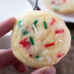 These Holiday Sprinkle Cookies are pillowy soft and melt-in-your mouth. They have a delicious buttery vanilla flavor and are packed with sprinkles. They're the perfect easy cookie recipe for your holiday baking. 