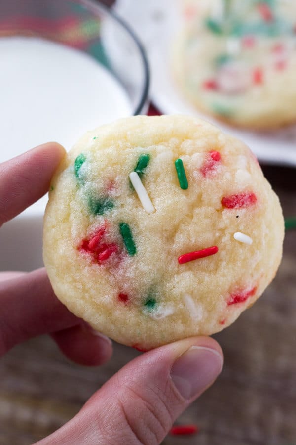 These Holiday Sprinkle Cookies are pillowy soft and melt-in-your mouth. They have a delicious buttery vanilla flavor and are packed with sprinkles. They're the perfect easy cookie recipe for your holiday baking. 
