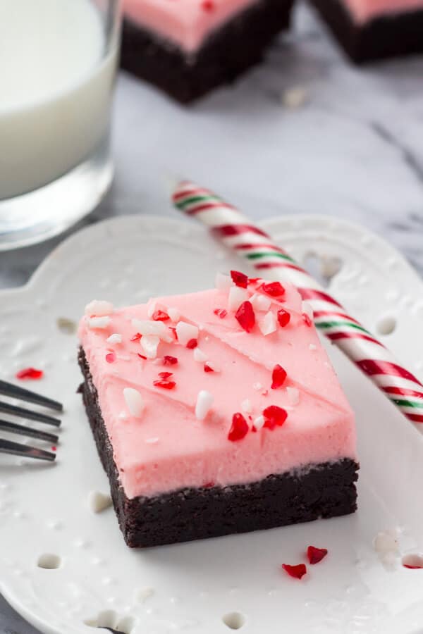 These candy cane brownies are the perfect Christmas brownies. They start with fudgy chewy brownies, then they're topped with a thick layer of creamy peppermint frosting and sprinkled with crushed candy canes. 