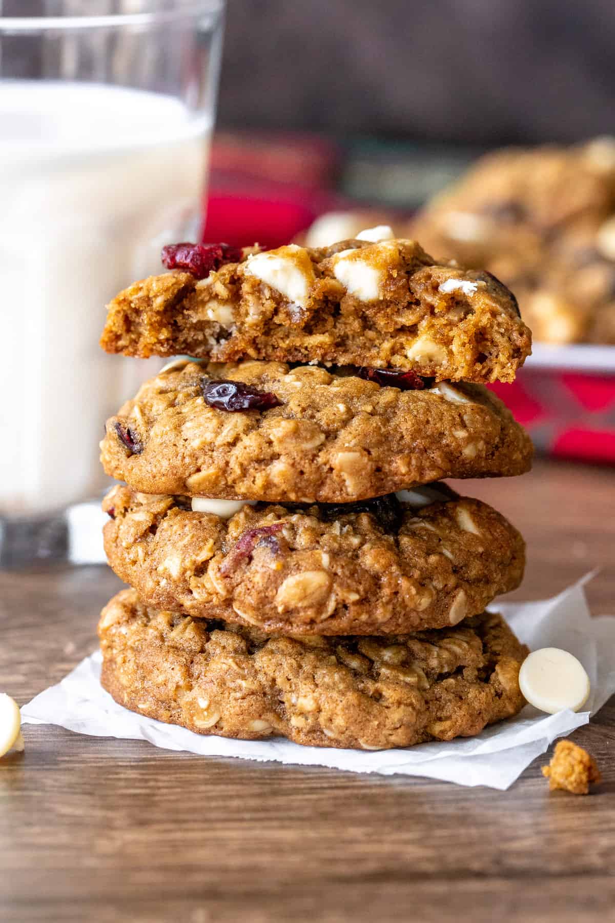 Stack of white chocolate cranberry oatmeal cookies with top cookie broken in half