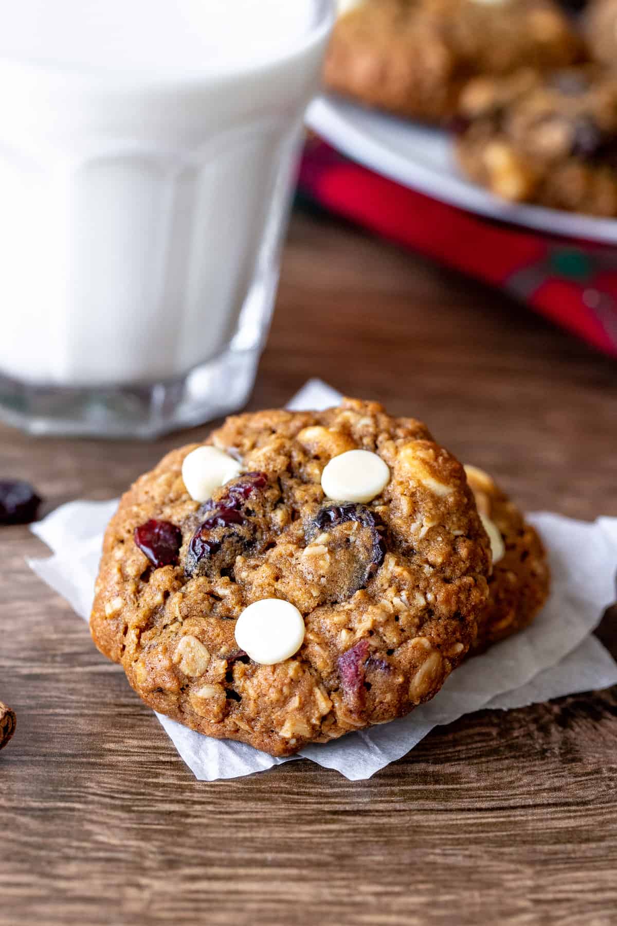 White chocolate cranberry oatmeal cookies with glass of milk