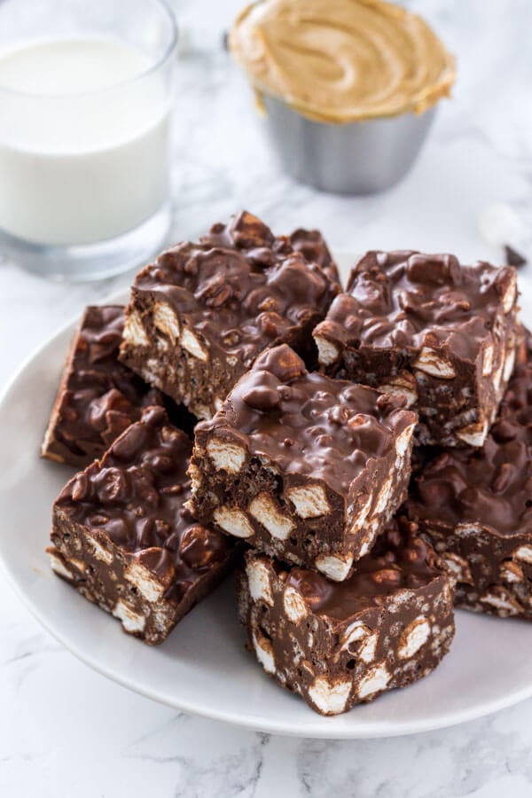 These No Bake Rocky Road Squares are the perfect easy recipe if you love peanut butter and chocolate. With only 5 ingredients - they're crispy, crunchy & gooey thanks to using Rice Krispie cereal and mini marshmallows. 