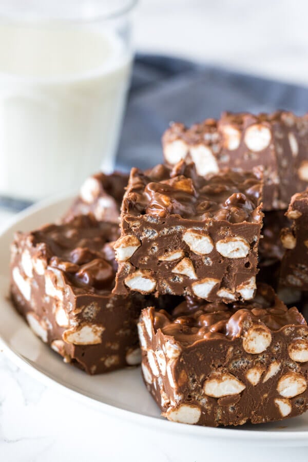 A plate of no bake rocky road bars with marshmallows and Rice Krispies