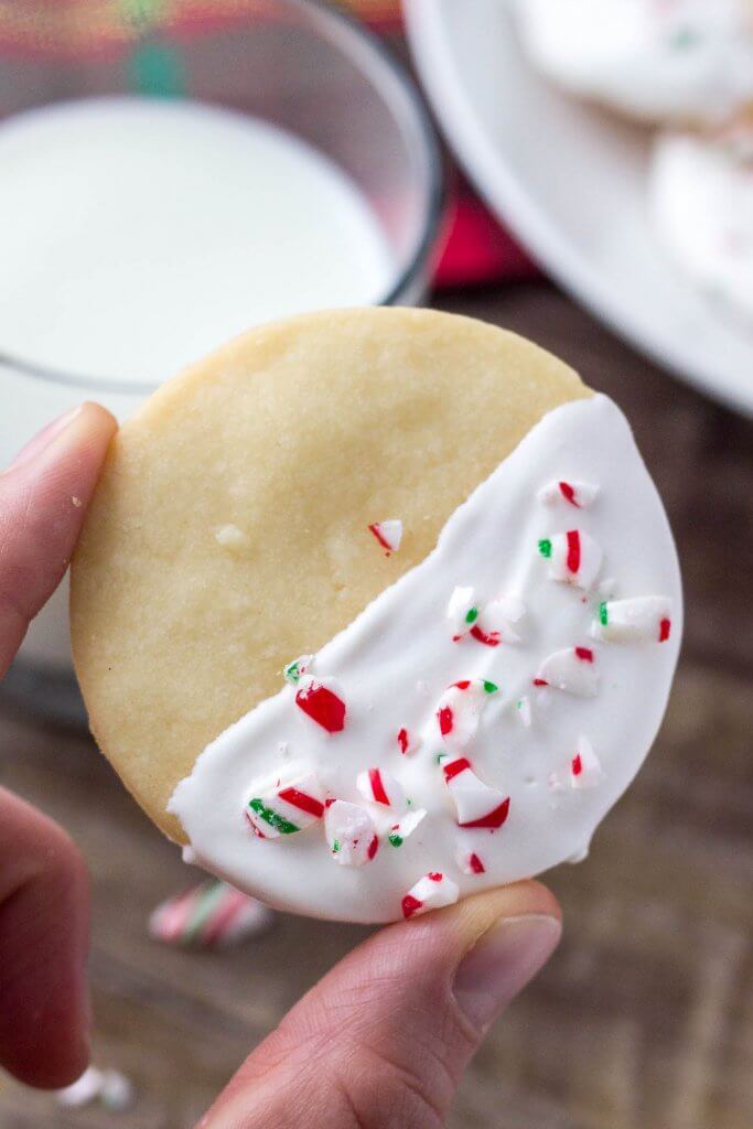 These white chocolate peppermint shortbread cookies are deliciously buttery & melt in your mouth. Then they're infused with peppermint, dipped in white chocolate and sprinkled with crushed candy canes. 