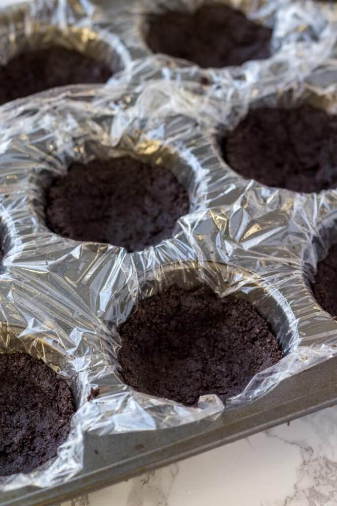 Mini no bake chocolate cheesecakes have an Oreo cookie crust that's made in a muffin tin. 