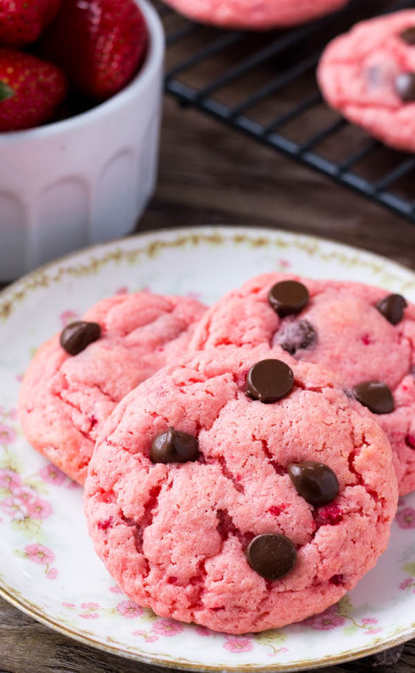A plate of strawberry cookies dotted with chocolate chips