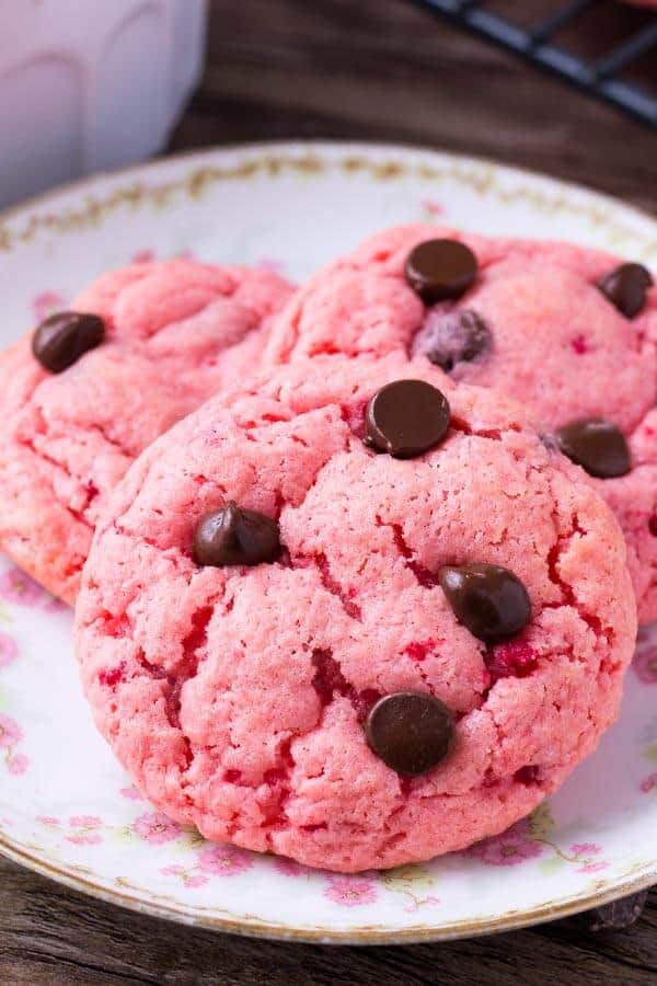 Strawberry cookies are soft and gooey. They're made with cake mix so they're super easy and filled with chocolate chips.