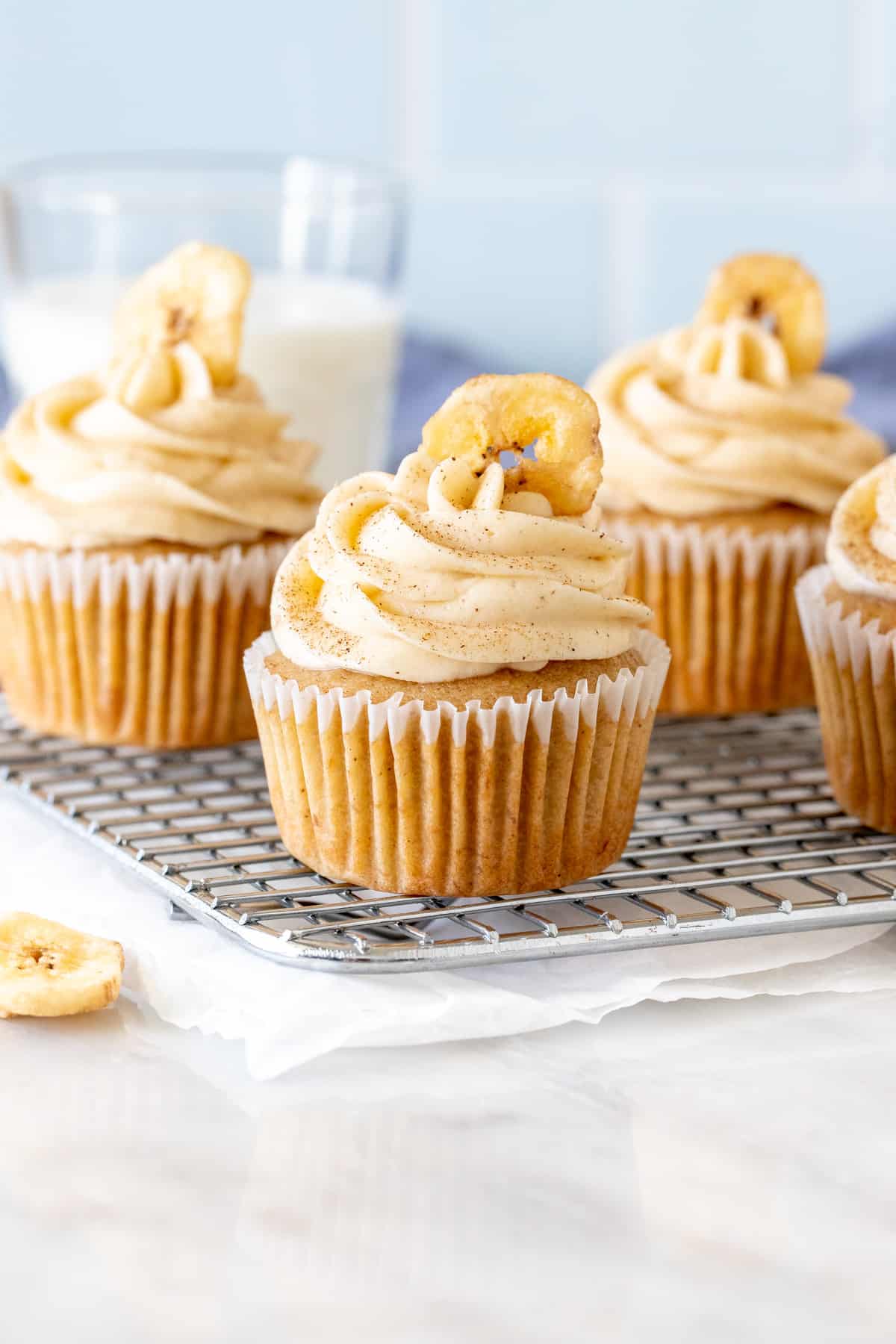 Banana Cupcakes with Cinnamon Cream Cheese Frosting with banana chips on top