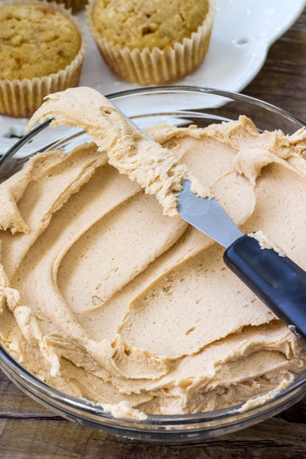 A bowl of peanut butter frosting for banana cupcakes.