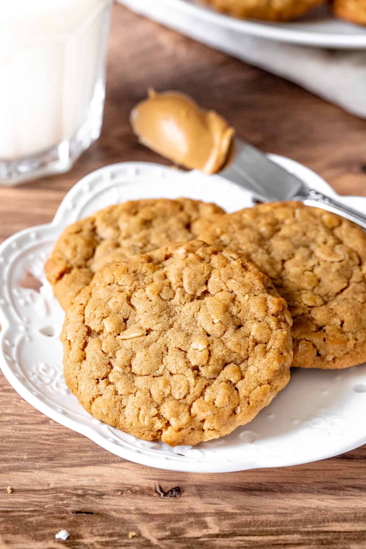 Plate of 3 peanut butter cookies made with oats.