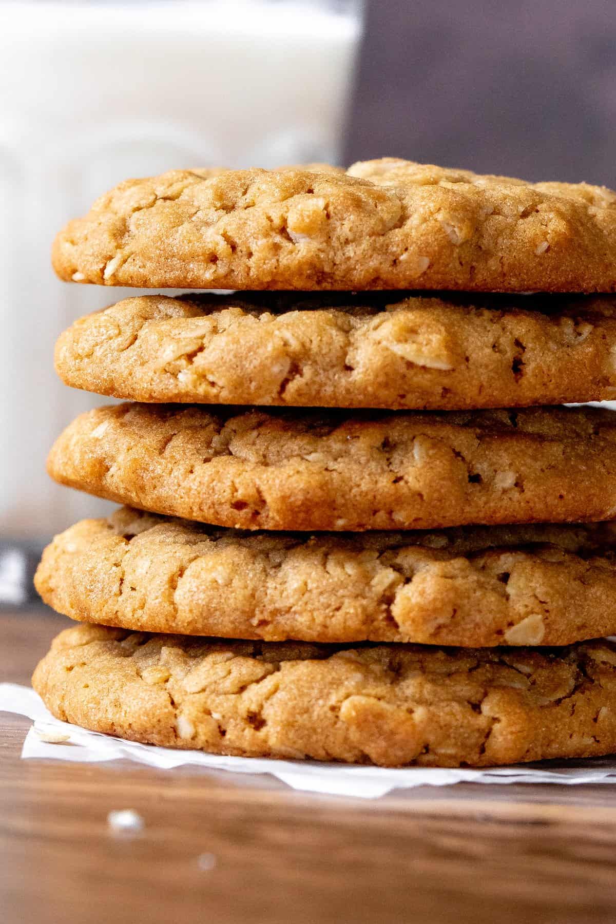 Stack of peanut butter oatmeal cookies with glass of milk
