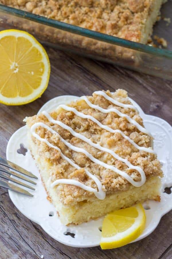This lemon coffee cake starts with a delicious dense, moist lemon cake. Then topped with crumb topping and a lemon cream cheese glaze.
