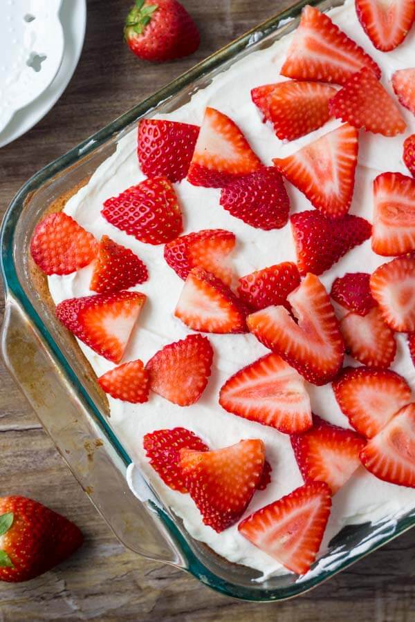Strawberry shortcake cake - a homemade strawberry cake with whipped cream topping and fresh berries. 