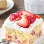 Homemade strawberry cake is super moist, with a delicious vanilla flavor and bursting with fresh berries. Then it's covered with a sweetened whipped cream topping and even more strawberries. 