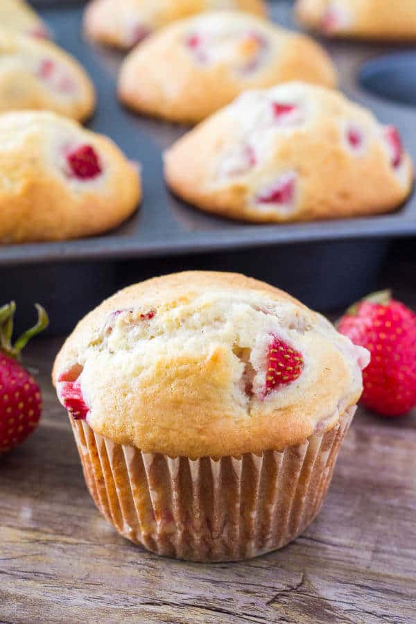 soft, buttery strawberry muffins have perfectly golden tops and are bursting with strawberries.
