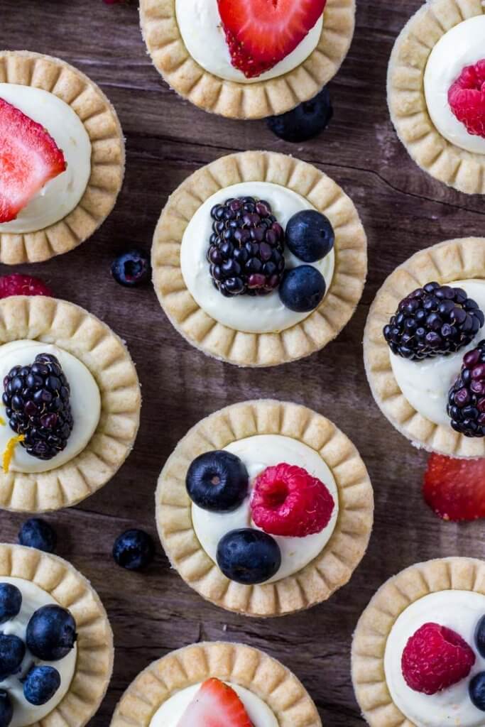 Mini fruit tarts have buttery pastry and a vanilla pudding filling. 