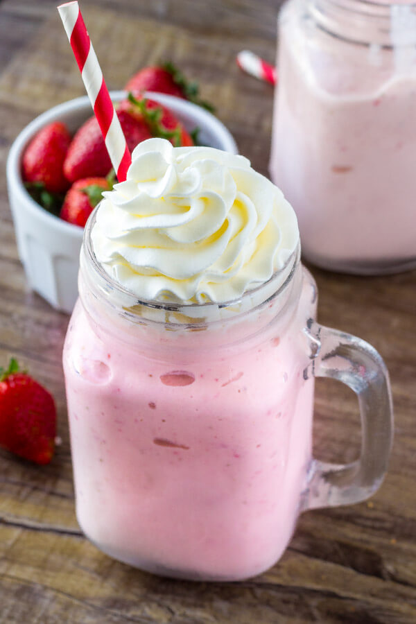 Super thick, extra creamy, strawberry milkshake. Made with real strawberries and vanilla ice cream - it's the perfect shake for a hot summer day.