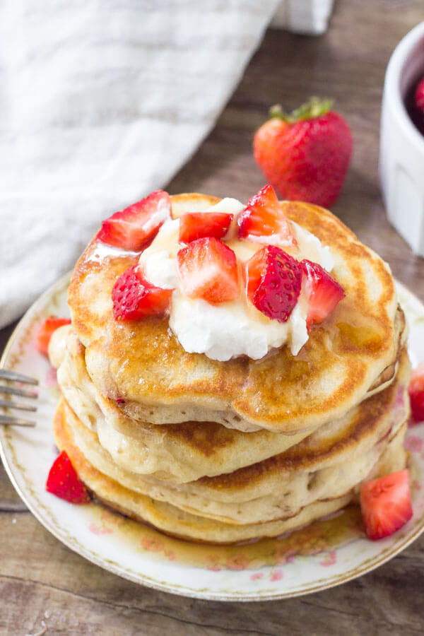 Strawberry pancakes are extra fluffy and filled with berries. Top them with maple syrup of strawberry syrup for the perfect breakfast. 