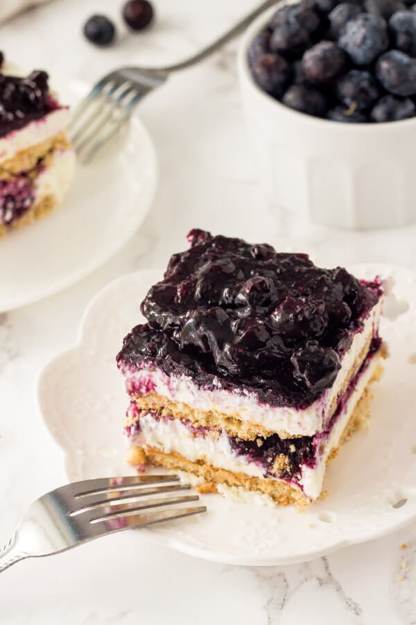 Blueberry Icebox Cake with layers of graham crackers, sweet cream cheese filling, and juicy blueberries. 