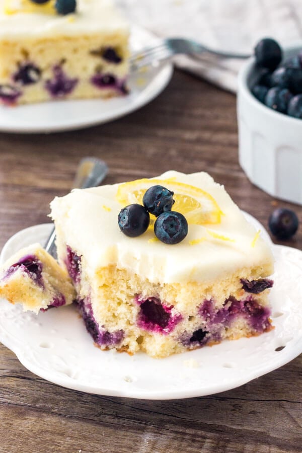This lemon blueberry cake starts with a moist & tender lemon cake that's dotted with juicy blueberries. Then it's topped with cream cheese frosting that has just a hint of l