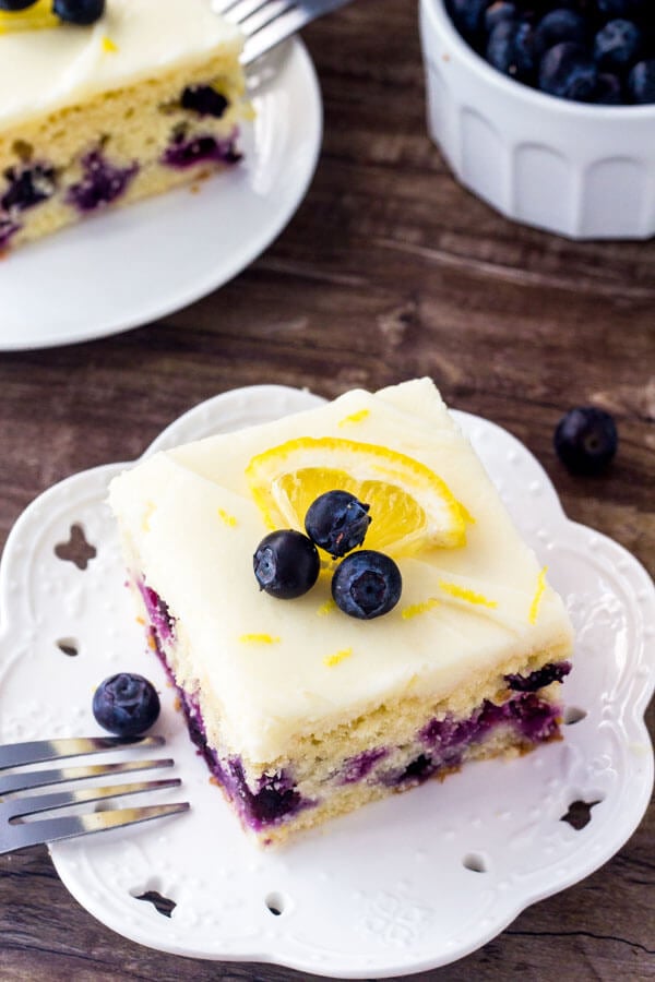 Blueberry lemon cake - moist lemon cake filled with berries and topped with cream cheese frosting.