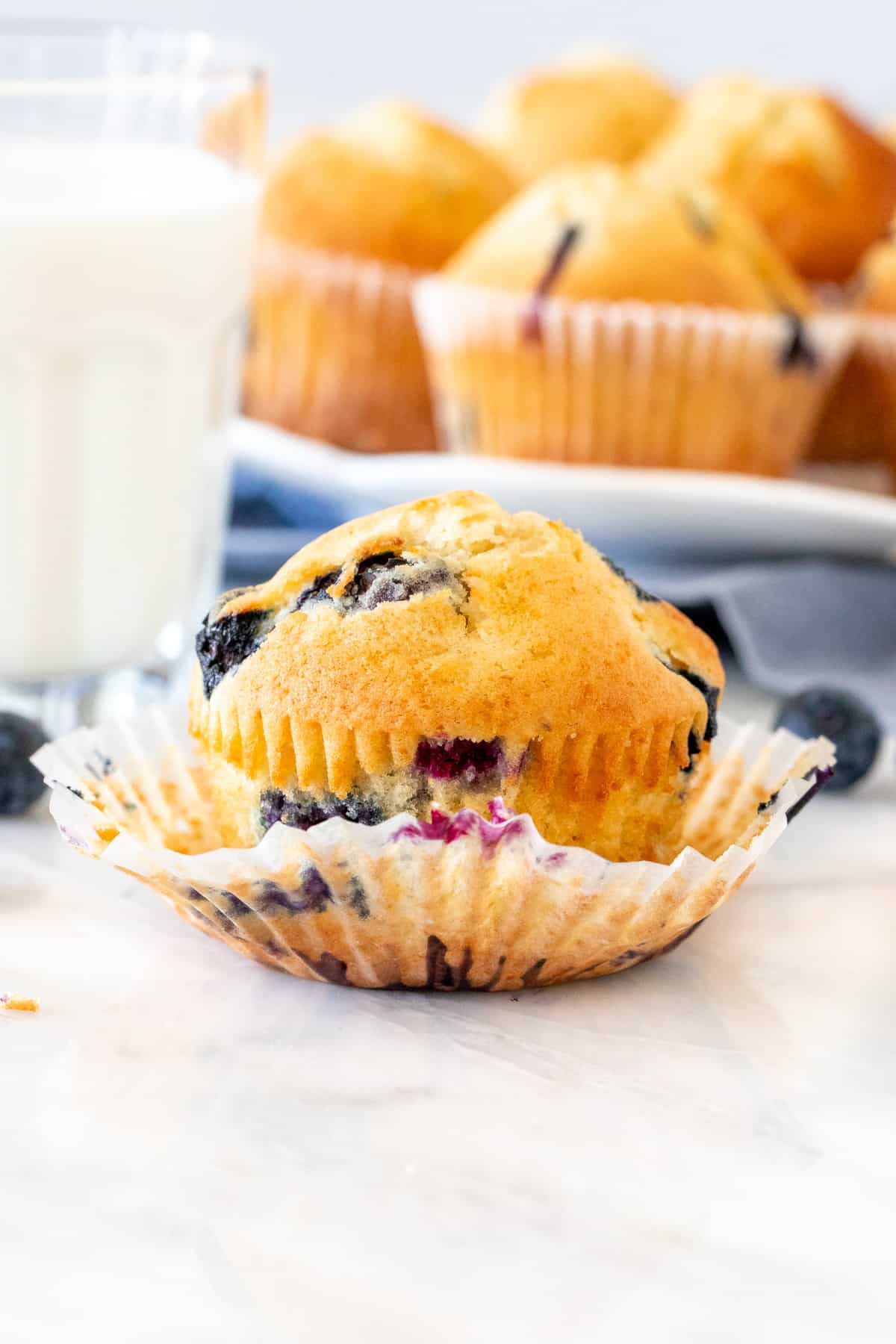Blueberry muffin with a glass of milk