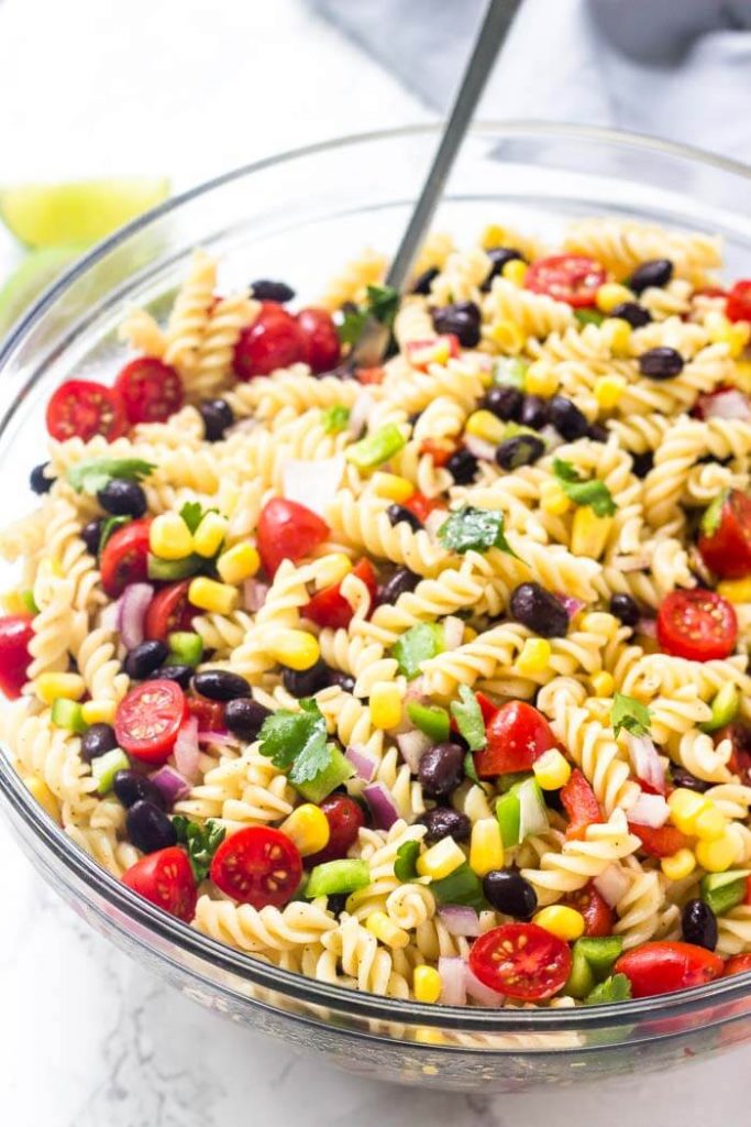Southwest pasta salad is an easy, delicious recipe for all your summer BBQs and potlucks. It's filled with veggies, corn, black beans & cilantro with a delicious chilli lime vinaigrette dressing.