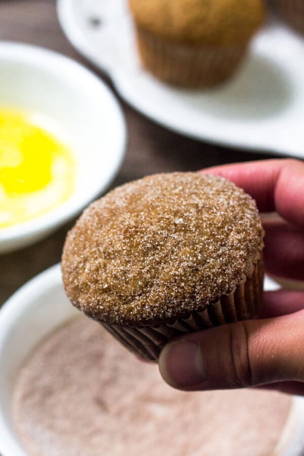Apple muffins are dipped in cinnamon sugar right after they come out of the oven. 