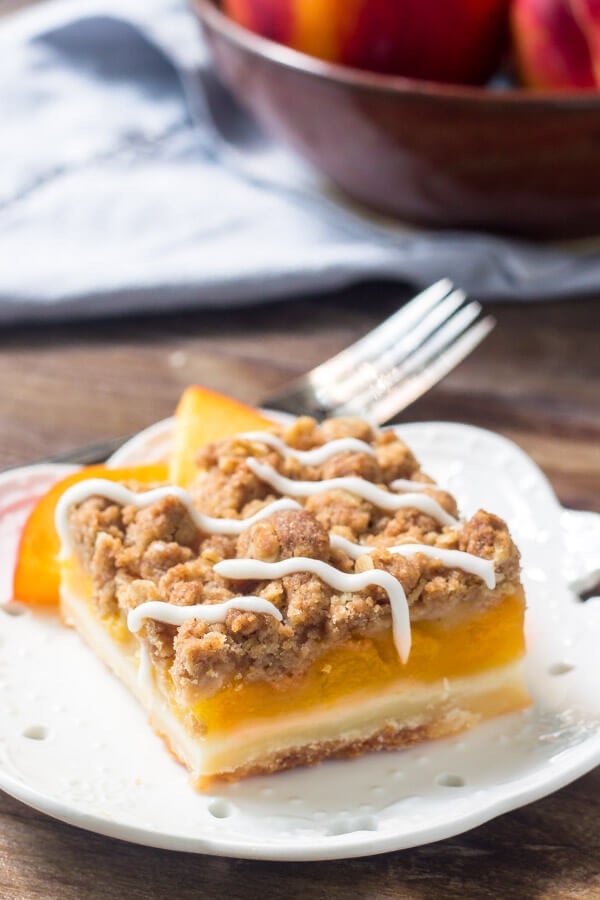 Peach Pie Crumb Bars are filled with juicy peaches & topped with buttery streusel topping. 