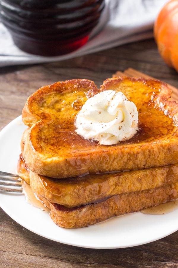 This Pumpkin French Toast is extra fluffy, filled with pumpkin spice & tastes amazing drizzled in maple syrup.