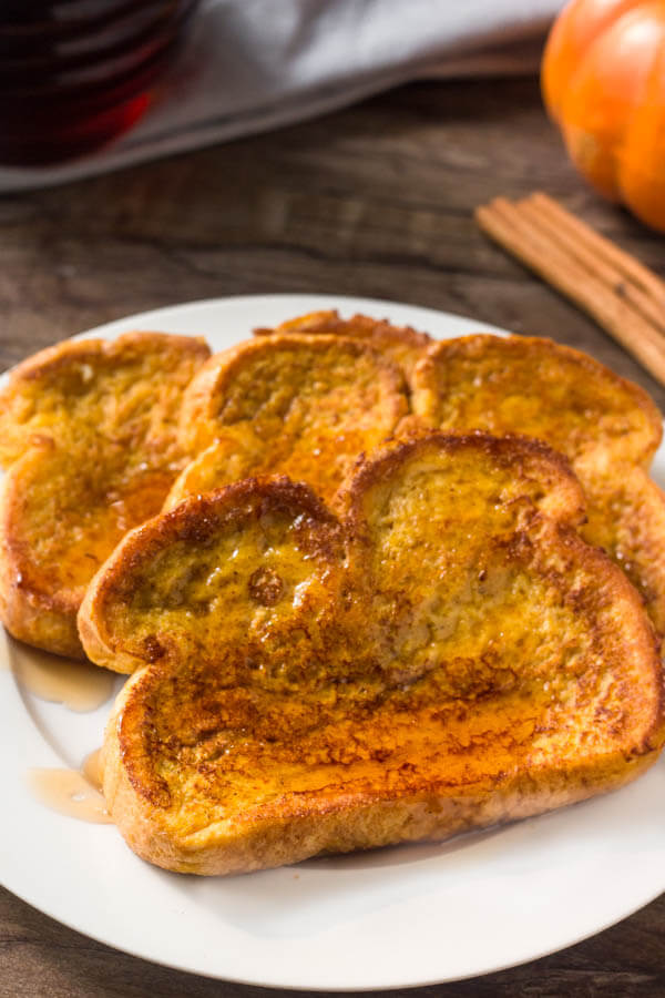 A plate of perfect pumpkin french toast. Extra fluffy with golden edges. 