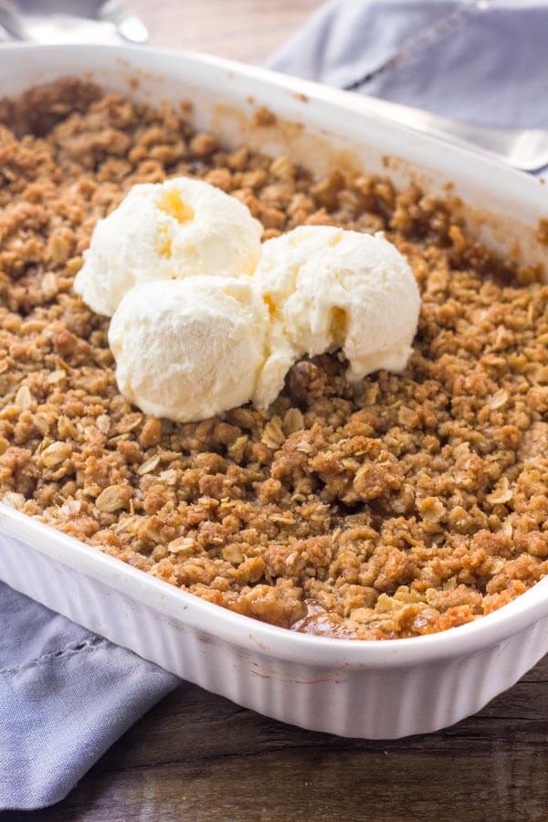 Easy apple crisp is made with simple pantry ingredients and fresh apples. Top it with ice cream for the perfect treat.
