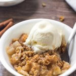 Warm apple crisp with cinnamon apples and oatmeal crumble topping makes for the perfect cozy dessert.