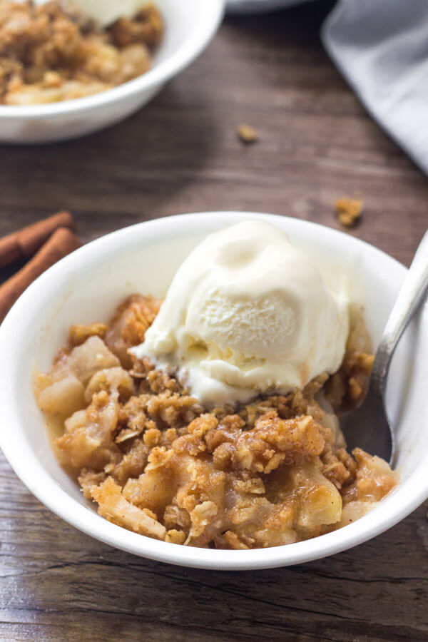 Warm apple crisp with cinnamon apples and oatmeal crumble topping makes for the perfect cozy dessert. 