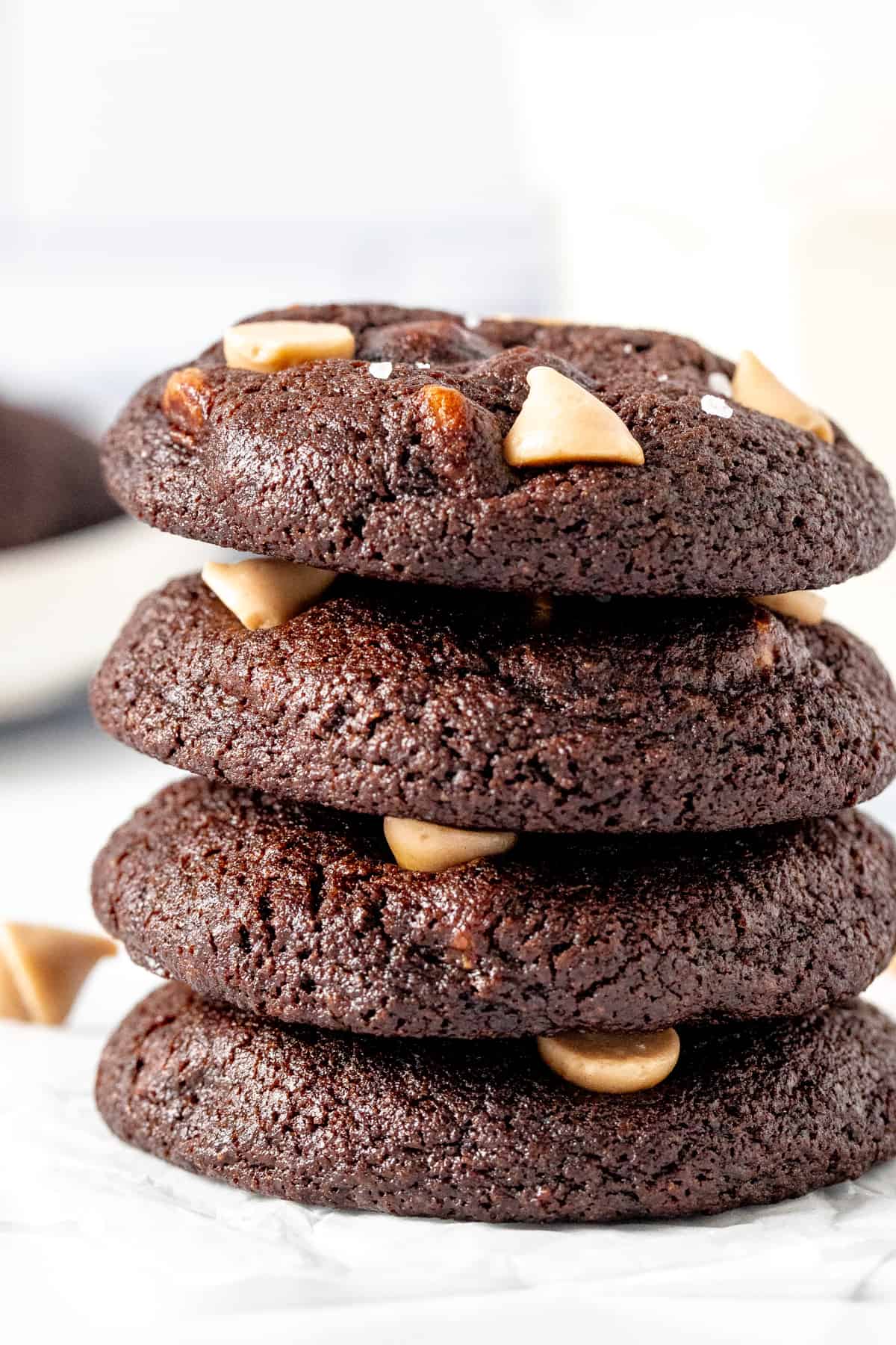 4 dark chocolate caramel cookies stacked on top of each other
