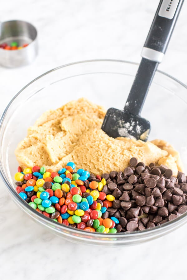 Bowl of cookie dough with mini M&Ms and chocolate chips. 