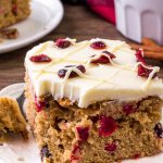 This cranberry Christmas cake is like a Cranberry Bliss Bar - but extra moist with tons of white chocolate cream cheese frosting.