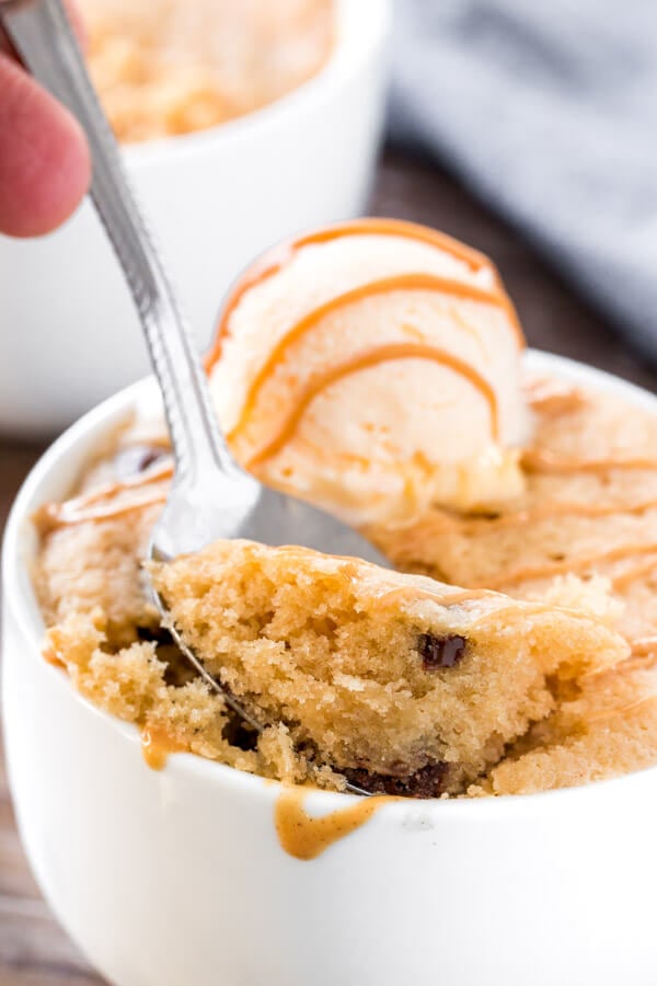 A bite of peanut butter mug cake that's moist and tender with chocolate chips. 