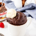 A fudgy, gooey Nutella Mug Cake with chocolate ice cream on top makes for the perfect single serving dessert.