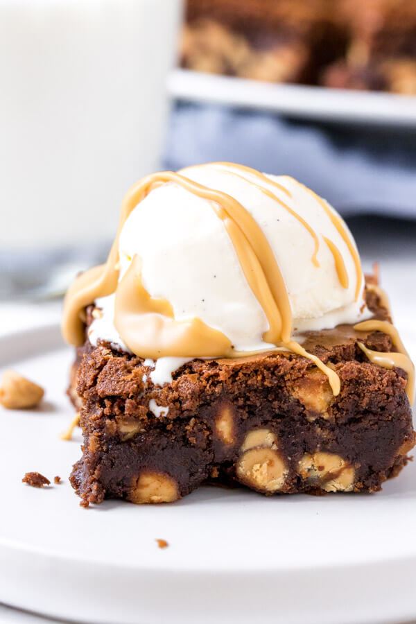 A gooey peanut butter brownie with vanilla ice cream and a drizzle of peanut butter. 