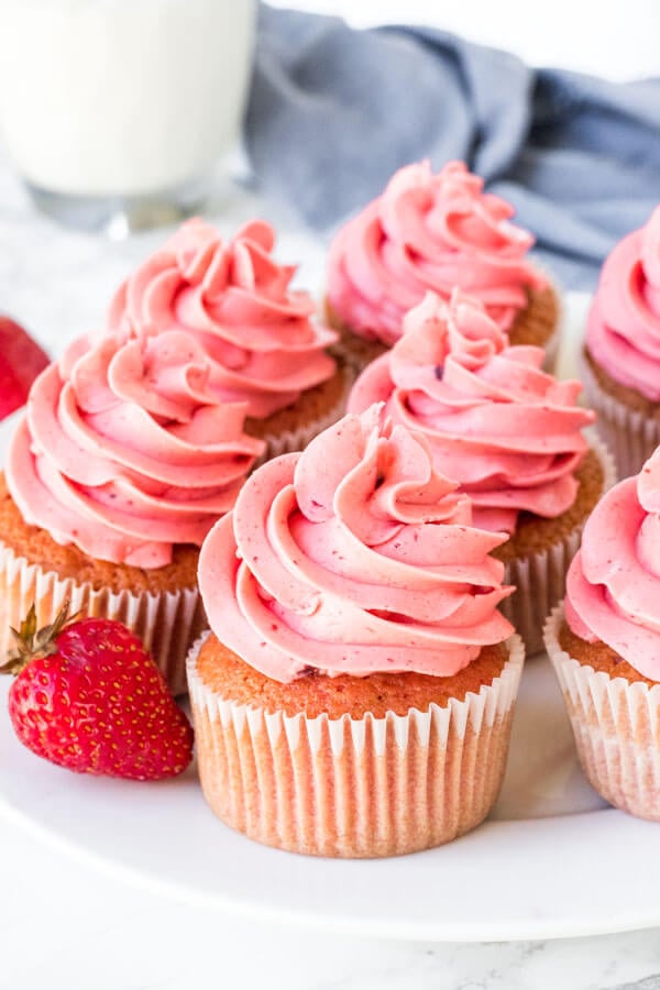 These fresh Strawberry Cupcakes have a delicious strawberry flavor and chunks of fresh strawberries in the cake batter. Then they’re frosted with strawberry frosting made from real berries for the perfect pretty-in-pink cupcake.