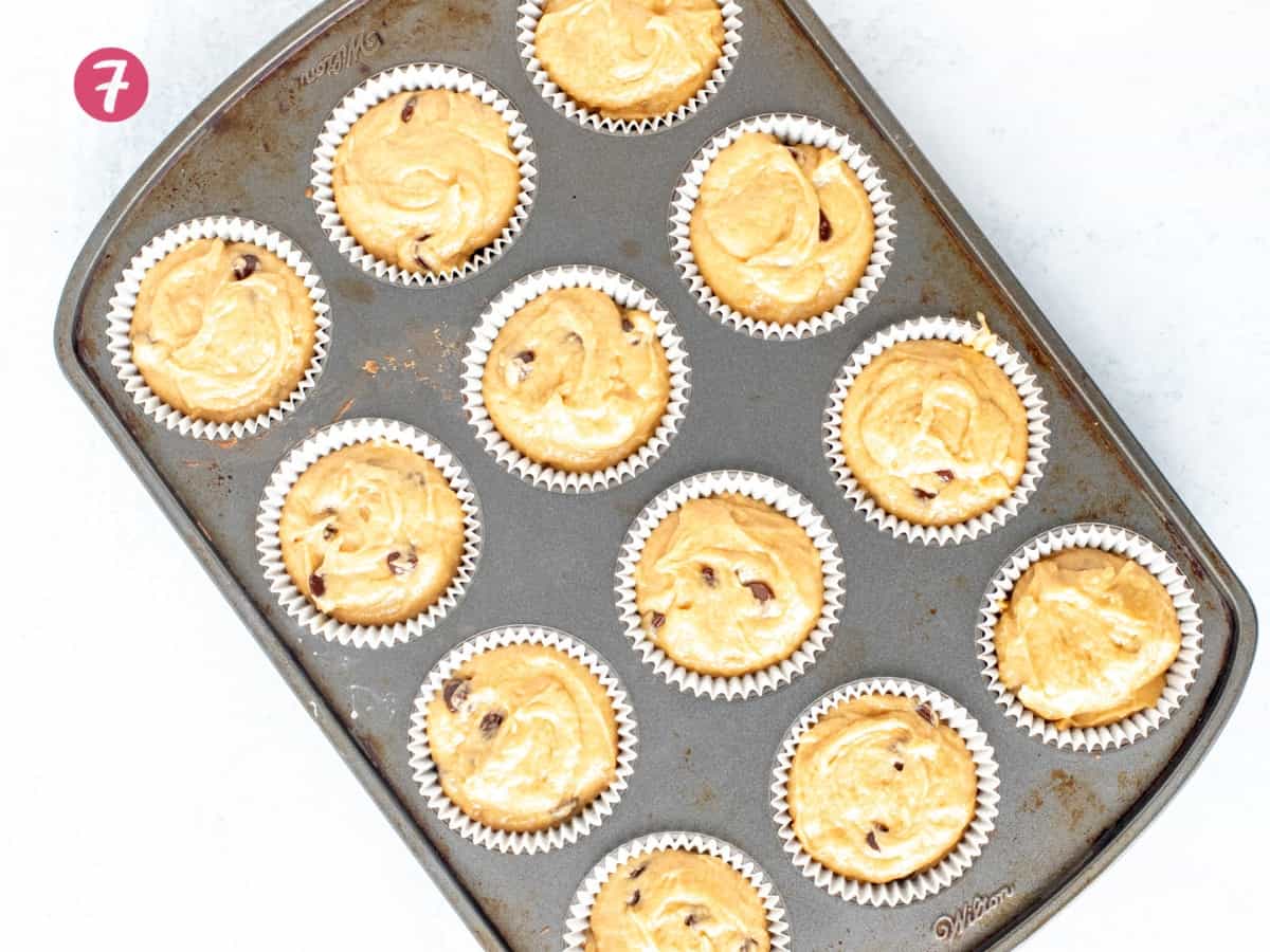 Muffin tin of unbaked peanut butter muffins