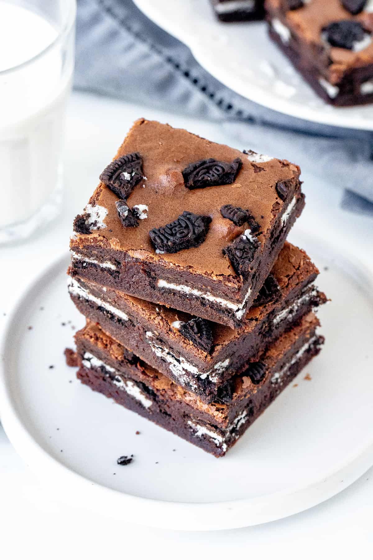 Plate of Oreo brownies with glass of milk