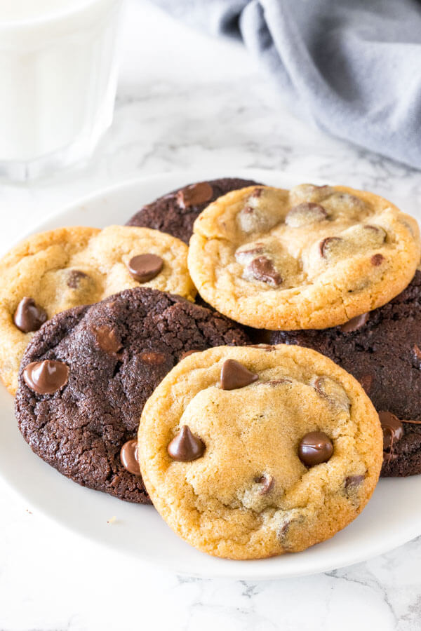 A plate of chocolate chip and double chocolate cookies.
