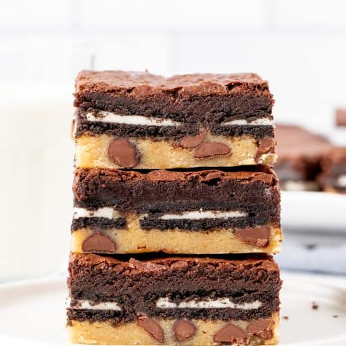 Stack of three slutty brownies on a plate