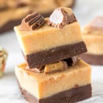 2 pieces of layered chocolate peanut butter fudge stacked on top of each other