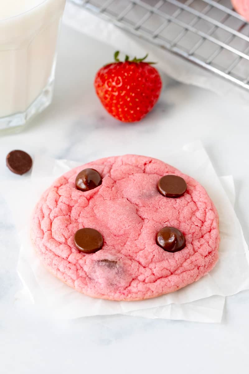 Strawberry cake mix cookie with glass of milk and strawberry
